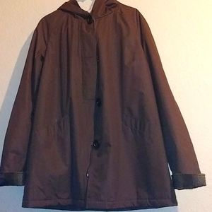 A warm quilt and wool winter coat with hood.